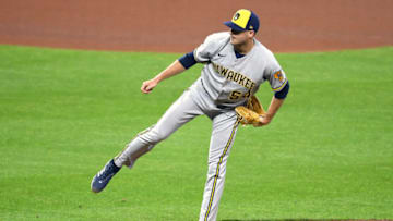 BALTIMORE, MARYLAND - APRIL 12: Jake Cousins #54 of the Milwaukee Brewers pitches during a baseball game against the Baltimore Orioles at the Orioles Park at Camden Yards on April 12, 2022 in Baltimore, Maryland. (Photo by Mitchell Layton/Getty Images)