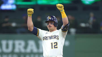 MILWAUKEE, WISCONSIN - MAY 18: Hunter Renfroe #12 of the Milwaukee Brewers reacts to a double during the second inning against the Atlanta Braves at American Family Field on May 18, 2022 in Milwaukee, Wisconsin. (Photo by Stacy Revere/Getty Images)