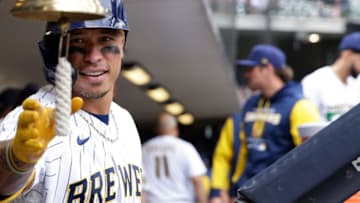 MILWAUKEE, WISCONSIN - JUNE 05: Kolten Wong #16 of the Milwaukee Brewers rings the bell after hitting his second home run of the game against the San Diego Padres at American Family Field on June 05, 2022 in Milwaukee, Wisconsin. (Photo by John Fisher/Getty Images)