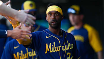 DENVER, CO - SEPTEMBER 5: Andrew McCutchen #24 of the Milwaukee Brewers celebrates after scoring a run in the fourth inning of a game against the Colorado Rockies at Coors Field on September 5, 2022 in Denver, Colorado. (Photo by Dustin Bradford/Getty Images)