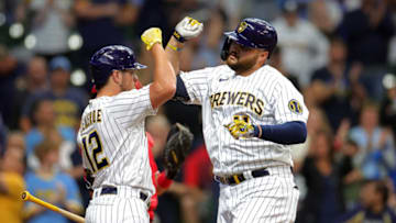 MILWAUKEE, WISCONSIN - SEPTEMBER 11: Rowdy Tellez #11 of the Milwaukee Brewers is congratulated by Hunter Renfroe #12 following a home run against the Cincinnati Reds during the fourth inning at American Family Field on September 11, 2022 in Milwaukee, Wisconsin. (Photo by Stacy Revere/Getty Images)