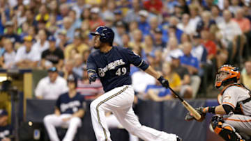 MILWAUKEE, WI - AUGUST 06: Yovani Gallardo #49 of the Milwaukee Brewers makes some contact at the plate during the game against the San Francisco Giants at Miller Park on August 06, 2014 in Milwaukee, Wisconsin. (Photo by Mike McGinnis/Getty Images)