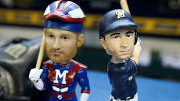 MILWAUKEE, WI - APRIL 22: Bobbleheads for Jonathan Lucroy #20, left, and Ryan Braun #8 of the Milwaukee Brewers sit on display at Miller Park on April 22, 2016 in Milwaukee, Wisconsin. (Photo by Dylan Buell/Getty Images)
