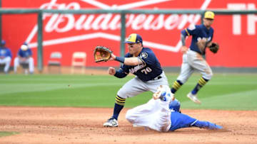 SURPRISE, AZ - MARCH 07: Ryan Goins #1 of the Kansas City Royals attempts to steal second base as Nate Orf #70 of the Milwaukee Brewers waits for the throw from catcher Christian Bethancourt #29 during the fourth inning of a spring training game at Surprise Stadium on March 7, 2018 in Surprise, Arizona. Goins was called out at second base. (Photo by Norm Hall/Getty Images)