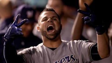 DENVER, CO - MAY 11: Manny Pena #9 of the Milwaukee Brewers celebrates in the dugout after hitting a 2 RBI home run to tie the game in the ninth inning against the Colorado Rockies at Coors Field on May 11, 2018 in Denver, Colorado. (Photo by Matthew Stockman/Getty Images)