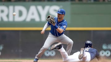 MILWAUKEE, WI - JUNE 27: Jonathan Villar #5 of the Milwaukee Brewers steals second base past Whit Merrifield #15 of the Kansas City Royals in the fifth inning at Miller Park on June 27, 2018 in Milwaukee, Wisconsin. (Photo by Dylan Buell/Getty Images)