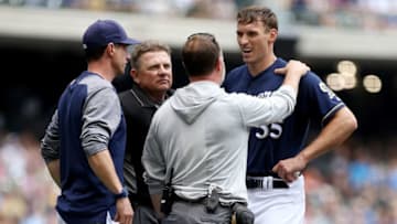 MILWAUKEE, WI - JUNE 27: Brent Suter #35 of the Milwaukee Brewers is examined after diving to field a ground ball in the fifth inning against the Kansas City Royals at Miller Park on June 27, 2018 in Milwaukee, Wisconsin. (Photo by Dylan Buell/Getty Images)