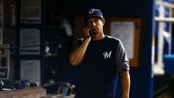 MIAMI, FL - JULY 09: Manager Craig Counsell #30 of the Milwaukee Brewers calls the bullpen in the fourth inning against the Miami Marlins at Marlins Park on July 9, 2018 in Miami, Florida. (Photo by Michael Reaves/Getty Images)