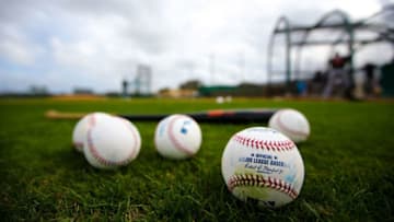 JUPITER, FL - FEBRUARY 23: Baseballs and a bat sit on the field of the Miami Marlins during a team workout on February 23, 2016 in Jupiter, Florida. (Photo by Rob Foldy/Getty Images)