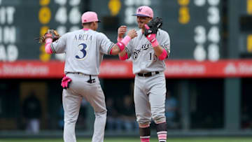 DENVER, CO - MAY 13: Orlando Arcia #3 and Tyler Saladino #13 of the Milwaukee Brewers celebrate their win against the Colorado Rockies at Coors Field on May 13, 2018 in Denver, Colorado. (Photo by Matthew Stockman/Getty Images)