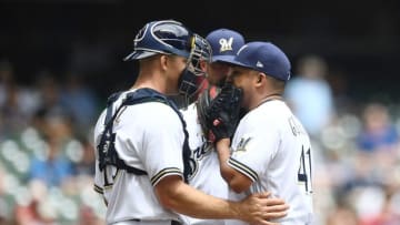 MILWAUKEE, WI - MAY 30: Erik Kratz #15 of the Milwaukee Brewers speaks with Junior Guerra #41 during the fifth inning of a game against the St. Louis Cardinals at Miller Park on May 30, 2018 in Milwaukee, Wisconsin. (Photo by Stacy Revere/Getty Images)