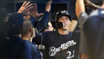 MILWAUKEE, WI - JULY 24: Christian Yelich #22 of the Milwaukee Brewers is congratulated by teammates following a two run home run against the Washington Nationals during the fifth inning of a game at Miller Park on July 24, 2018 in Milwaukee, Wisconsin. (Photo by Stacy Revere/Getty Images)