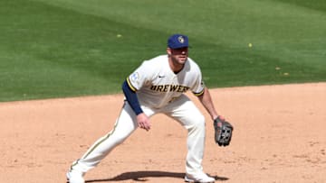 PHOENIX, ARIZONA - MARCH 04: Travis Shaw #21 of the the Milwaukee Brewers gets ready to make a play against the Cleveland Indians during a spring training game at American Family Fields of Phoenix on March 04, 2021 in Phoenix, Arizona. (Photo by Norm Hall/Getty Images)
