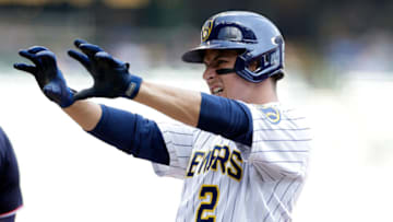 MILWAUKEE, WISCONSIN - AUGUST 22: Luis Urias #2 of the Milwaukee Brewers celebrates a single in the second inning against the Washington Nationals at American Family Field on August 22, 2021 in Milwaukee, Wisconsin. (Photo by John Fisher/Getty Images)