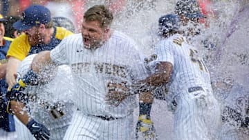 MILWAUKEE, WISCONSIN - SEPTEMBER 05: Daniel Vogelbach #20 of the Milwaukee Brewers gets a water and gatorade bath after hitting a walk-off grand slam in the ninth inning against the St. Louis Cardinals at American Family Field on September 05, 2021 in Milwaukee, Wisconsin. (Photo by John Fisher/Getty Images)