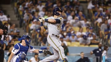 LOS ANGELES, CALIFORNIA - OCTOBER 02: Christian Yelich #22 of the Milwaukee Brewers bats against the Los Angeles Dodgers during the seventh inning at Dodger Stadium on October 02, 2021 in Los Angeles, California. (Photo by Michael Owens/Getty Images)