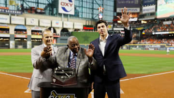HOUSTON, TEXAS - OCTOBER 23: Christian Yelich of the Milwaukee Brewers is presented the Hank Aaron award by Joe Torre and Hank Aaron prior to Game Two of the 2019 World Series between the Houston Astros and the Washington Nationals at Minute Maid Park on October 23, 2019 in Houston, Texas. (Photo by Matt Slocum-Pool/Getty Images)