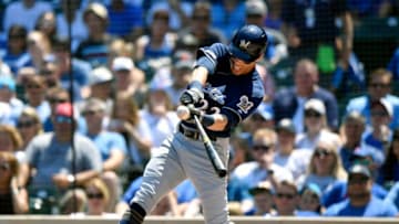 CHICAGO, ILLINOIS - AUGUST 04: Christian Yelich #22 of the Milwaukee Brewers hits a solo home run in the first inning against the Chicago Cubs at Wrigley Field on August 04, 2019 in Chicago, Illinois. (Photo by Quinn Harris/Getty Images)