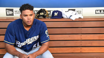 LOS ANGELES, CA - JULY 30: Freddy Peralta #51 of the Milwaukee Brewers sits in the dugout during the game against the Los Angeles Dodgers at Dodger Stadium on July 30, 2018 in Los Angeles, California. (Photo by Jayne Kamin-Oncea/Getty Images)