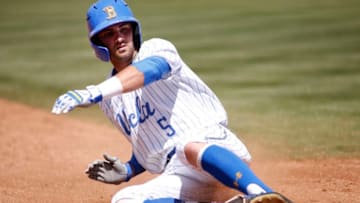 LOS ANGELES, CALIFORNIA - MAY 19: Garrett Mitchell #5 of UCLA slides into third base during a baseball game against University of Washington at Jackie Robinson Stadium on May 19, 2019 in Los Angeles, California. (Photo by Katharine Lotze/Getty Images)