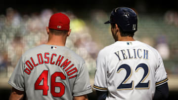 MILWAUKEE, WISCONSIN - AUGUST 28: Paul Goldschmidt #46 of the St. Louis Cardinals and Christian Yelich #22 of the Milwaukee Brewers meet at first base in the eighth inning at Miller Park on August 28, 2019 in Milwaukee, Wisconsin. (Photo by Dylan Buell/Getty Images)