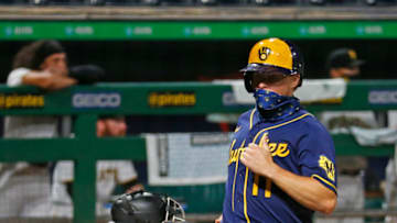 PITTSBURGH, PA - JULY 27: Brock Holt #11 of the Milwaukee Brewers scores on an RBI double in the eleventh inning against the Pittsburgh Pirates during Opening Day at PNC Park on July 27, 2020 in Pittsburgh, Pennsylvania. (Photo by Justin K. Aller/Getty Images)