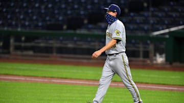 PITTSBURGH, PA - JULY 28: Manager Craig Counsell #30 of the Milwaukee Brewers walks to the mound during the fifth inning agains the Pittsburgh Pirates at PNC Park on July 28, 2020 in Pittsburgh, Pennsylvania. (Photo by Joe Sargent/Getty Images)