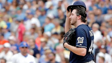 CHICAGO, IL - AUGUST 13: Tyler Cravy #45 of the Milwaukee Brewers reacts after giving up a two run home run to Dexter Fowler #24 of the Chicago Cubs (not pictured) during the fifth inning at Wrigley Field on August 13, 2015 in Chicago, Illinois. (Photo by Jon Durr/Getty Images)