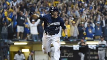 Oct 4, 2018; Milwaukee, WI, USA; Milwaukee Brewers third baseman Mike Moustakas (18) celebrates as he hits a walk off RBI single against the Colorado Rockies in the 10th inning in game one of the 2018 NLDS playoff baseball series at Miller Park. Mandatory Credit: Benny Sieu-USA TODAY Sports