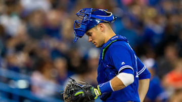 Jun 20, 2019; Toronto, Ontario, CAN; Toronto Blue Jays catcher Luke Maile (21) looks on against the Los Angeles Angels at Rogers Centre. Mandatory Credit: Kevin Sousa-USA TODAY Sports