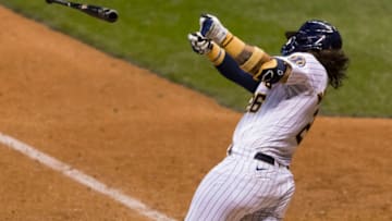 Sep 18, 2020; Milwaukee, Wisconsin, USA; Milwaukee Brewers catcher Jacob Nottingham (26) loses his bat while swinging at a pitch during the seventh inning against the Kansas City Royals at Miller Park. Mandatory Credit: Jeff Hanisch-USA TODAY Sports