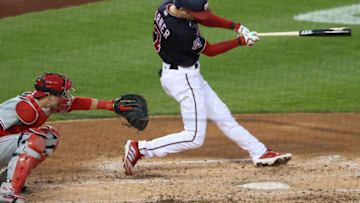 Sep 22, 2020; Washington, District of Columbia, USA; Washington Nationals shortstop Trea Turner (7) hits a single against the Philadelphia Phillies in the third inning at Nationals Park. Mandatory Credit: Geoff Burke-USA TODAY Sports