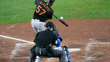 Sep 25, 2020; Buffalo, New York, USA; Baltimore Orioles second baseman Hanser Alberto (57) hits an RBI double during the sixth inning against the Toronto Blue Jays at Sahlen Field. Mandatory Credit: Gregory Fisher-USA TODAY Sports