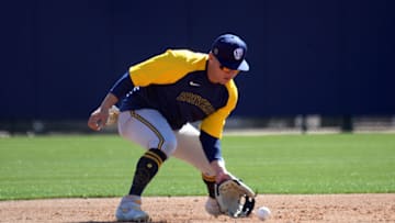 Feb 23, 2021; Phoenix, Arizona, USA; Milwaukee Brewers infielder Luis Urias fields a ground ball during a spring training workout at American Family Fields of Phoenix. Mandatory Credit: Joe Camporeale-USA TODAY Sports