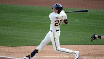 Mar 4, 2021; Phoenix, Arizona, USA; Milwaukee Brewers left fielder Christian Yelich (22) bats against the Cleveland Indians during the first inning of a spring training game at American Family Fields of Phoenix. Mandatory Credit: Joe Camporeale-USA TODAY Sports