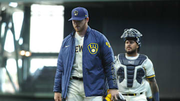 Apr 1, 2021; Milwaukee, Wisconsin, USA; Milwaukee Brewers starting pitcher Brandon Woodruff (53) and catcher Milwaukee Brewers catcher Omar Narvaez (10) walk in from the bullpen prior to the start of their game with the Minnesota Twins at American Family Field. Mandatory Credit: Michael McLoone-USA TODAY Sports