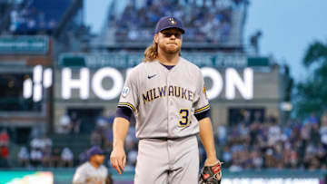 Aug 11, 2021; Chicago, Illinois, USA; Milwaukee Brewers starting pitcher Corbin Burnes (39) returns to the dugout after pitching against the Chicago Cubs during the first inning at Wrigley Field. Mandatory Credit: Kamil Krzaczynski-USA TODAY Sports