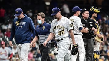 Sep 3, 2021; Milwaukee, Wisconsin, USA; Milwaukee Brewers pitcher Justin Topa (56) leaves the game against the St. Louis Cardinals after suffering an apparent injury in the third inning at American Family Field. Mandatory Credit: Benny Sieu-USA TODAY Sports