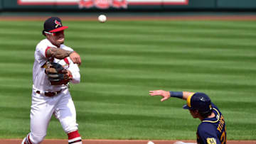 Sep 27, 2020; St. Louis, Missouri, USA; St. Louis Cardinals second baseman Kolten Wong (16) turns a double play as Milwaukee Brewers left fielder Christian Yelich (22) slides during the first inning at Busch Stadium. Mandatory Credit: Jeff Curry-USA TODAY Sports