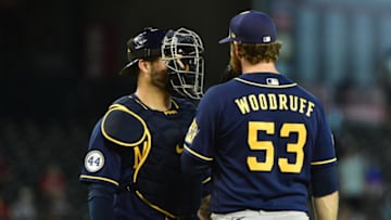 Jun 23, 2021; Phoenix, Arizona, USA; Milwaukee Brewers catcher Manny Pina (9) talks with starting pitcher Brandon Woodruff (53) in the fourth inning against the Arizona Diamondbacks at Chase Field. Mandatory Credit: Matt Kartozian-USA TODAY Sports