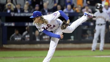 Oct 5, 2016; New York City, NY, USA; New York Mets starting pitcher Noah Syndergaard (34) throws during the first inning against the San Francisco Giants in the National League wild card playoff baseball game at Citi Field. Mandatory Credit: Anthony Gruppuso-USA TODAY Sports