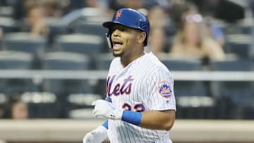 NEW YORK, NY - AUGUST 22: Dominic Smith #22 of the New York Mets celebrates his solo home run in the second inning against the San Francisco Giants on August 22, 2018 at Citi Field in the Flushing neighborhood of the Queens borough of New York City. (Photo by Elsa/Getty Images)
