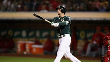 OAKLAND, CA - SEPTEMBER 19: Stephen Piscotty #25 of the Oakland Athletics hits a three-run home run in the fifth inning against the Los Angeles Angels at Oakland Alameda Coliseum on September 19, 2018 in Oakland, California. (Photo by Ezra Shaw/Getty Images)