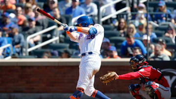 NEW YORK, NEW YORK - APRIL 06: J.D. Davis #28 of the New York Mets follows through on a fourth inning home run against the Washington Nationals at Citi Field on April 06, 2019 in the Flushing neighborhood of the Queens borough of New York City. (Photo by Jim McIsaac/Getty Images)