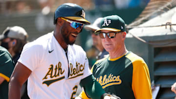 OAKLAND, CALIFORNIA - SEPTEMBER 11: Starling Marte #2 of the Oakland Athletics celebrates with Manager Bob Melvin #6 after hitting a solo home run in the bottom of the first inning against the Texas Rangers at RingCentral Coliseum on September 11, 2021 in Oakland, California. (Photo by Lachlan Cunningham/Getty Images)