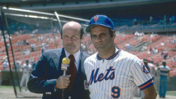 NEW YORK - CIRCA 1980: Manager Joe Torre #9 of the New York Mets gets interviewed by NBC sport personality Joe Garagiola prior to the start of a Major League Baseball game circa 1980 at Shea Stadium in the Queens borough of New York City. Torre managed the Mets from 1977-81. (Photo by Focus on Sport/Getty Images)
