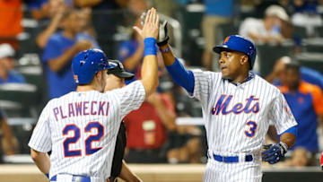 NEW YORK, NY - AUGUST 02: (NEW YORK DAILIES OUT) Curtis Granderson #3 and Kevin Plawecki #22 of the New York Mets in action against the Washington Nationals at Citi Field on August 2, 2015 in the Flushing neighborhood of the Queens borough of New York City. The Mets defeated the Nationals 5-2. (Photo by Jim McIsaac/Getty Images)