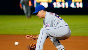 ATLANTA, GA - SEPTEMBER 10: Kelly Johnson #55 of the New York Mets scoops up a grounder hit by Michael Bourn #2 of the Atlanta Braves in the seventh inning at Turner Field on September 10, 2015 in Atlanta, Georgia. (Photo by Kevin C. Cox/Getty Images)