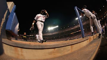 ATLANTA, GA - JULY 31: Mike Cameron #44 of the New York Mets returns to the dugout against the Atlanta Braves in a game on July 31, 2004 at Turner Field in Atlanta, Georgia. (Photo by Scott Cunningham/Getty Images)
