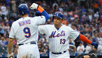 NEW YORK, NY - JUNE 09: Asdrubal Cabrera #13 of the New York Mets is congratulated by Brandon Nimmo #9 after both scored on Cabrea's home run against the New York Yankees during the first inning of a game at Citi Field on June 9, 2018 in the Flushing neighborhood of the Queens borough of New York City. (Photo by Rich Schultz/Getty Images)
